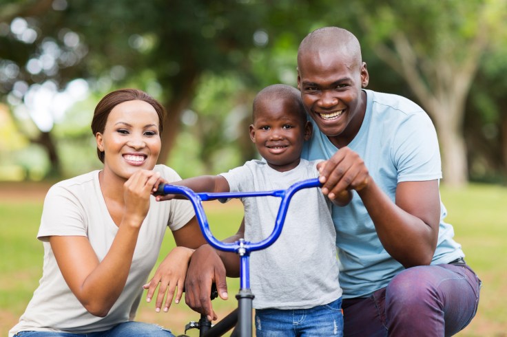 afro american family having fun together outdoors